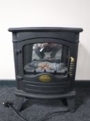 A Sheldam electric heater in the form of a stove