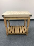 A reclaimed pine two tier butcher's block table
