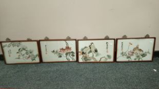 Set of four Chinese silk panels depicting birds, framed.