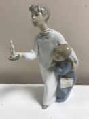 A Lladro figurine : Children in Nightshirts, model 4874, height 20 cm, boxed.