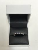 An 18ct white gold sapphire and diamond eternity ring CONDITION REPORT: Size V.