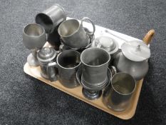 A tray of antique and later pewter tankards,