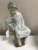 A Lladro figurine : Thinker Little Boy, model 4876, height 21 cm, boxed.