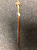 A tribal style staff with studded decoration CONDITION REPORT: Splits to head.