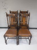 Four carved oak Edwardian dining chairs
