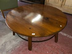 A circular pine "wagon wheel" coffee table