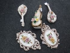 A pair of Capo Di Monte ceramic oval-shaped rose wall plaques, height 32 cm,