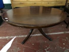 An oval inlaid mahogany pedestal coffee table