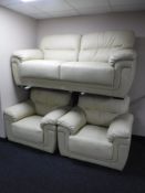 A cream leather three piece lounge suite