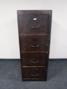 An early 20th century wooden four drawer filing chest with locking mechanism