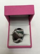 An unusual 18ct white gold and diamond set snake ring