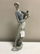 A Lladro figurine : Girl with Jugs, model 4875, height 33 cm, boxed.