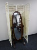 A mahogany framed cheval mirror and a wicker four fold screen