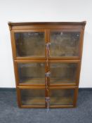 A mid 20th century three tier stacking office bookcase