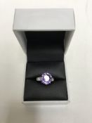 An 18ct white gold Alexandrite ring, a brilliant cut Alexandrite within a claw setting,