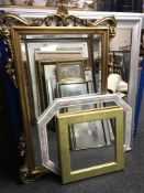 A gilt framed mirror together with three further contemporary mirrors