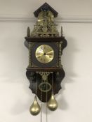 A continental wall clock with weights