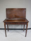 A George III inlaid mahogany foldover tea table