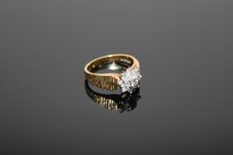 An 18ct gold diamond cluster ring, size L CONDITION REPORT: 5.