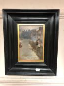 Continental school : two figures in a street, oil on canvas, indistinctly signed, framed.