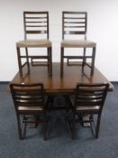 An early 20th century pull out table and a set of six antique style chairs