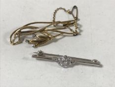 Two gold diamond set brooches, 7.