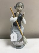 A Lladro figurine : A Clean Sweep, model 5025, height 24 cm, boxed.