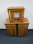 A pair of pine bedside cabinets, a nest of tables,
