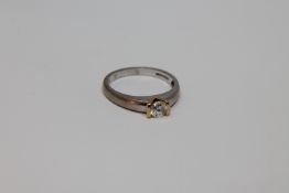 An 18ct gold solitaire diamond ring, approximately 0.