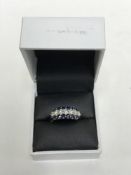An 18ct white gold sapphire and diamond ring