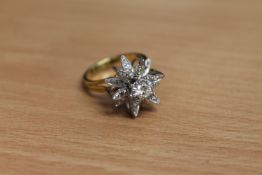 An 18ct gold diamond set ring, the principal stone weighing an estimated 0.3 carat, 7.