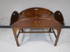 A mahogany butler's table with lift off tray