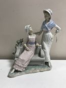 A Lladro figurine : Talking Ladies, model 5042, height 37 cm, boxed.