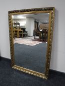 A gilt framed bevelled mirror together with a contemporary all glass mirror