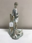 A Lladro figurine : Countryside Shepherd Boy with Sheep and Lamb, model 4509, height 28 cm, boxed.