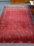 A Bokhara carpet on red ground, Afghanistan,
