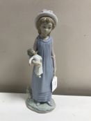 A Lladro figurine : Belinda with her Doll, model 5045, height 29 cm, boxed.