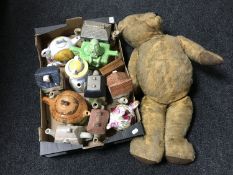 A vintage Teddy bear together with a box of teapots