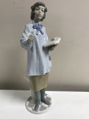 A Lladro figurine : Teacher Woman, model 5048, height 38 cm, unboxed.