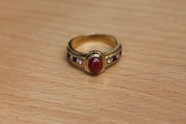 An 18ct gold ruby and diamond ring,