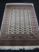 A Bokhara rug, 1.9m x 1.