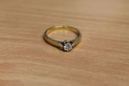 An 18ct gold diamond solitaire ring, approximately 0.25ct, size M.