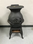 A cast iron pot belly stove