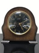 An oak cased Smith's mantel clock