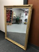 A Victorian style bevelled gilded overmantel mirror