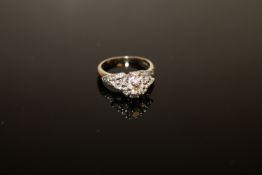 An 18ct gold diamond cluster ring, size I/J.