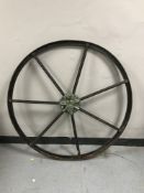 An antique cast iron wagon wheel,