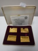 A cased set of four silver-gilt Railway Anniversary Stamps, issue No.