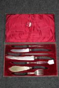 A cased late 19th century carving set by Joseph Rogers & Co,