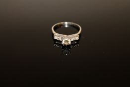 A diamond solitaire ring,